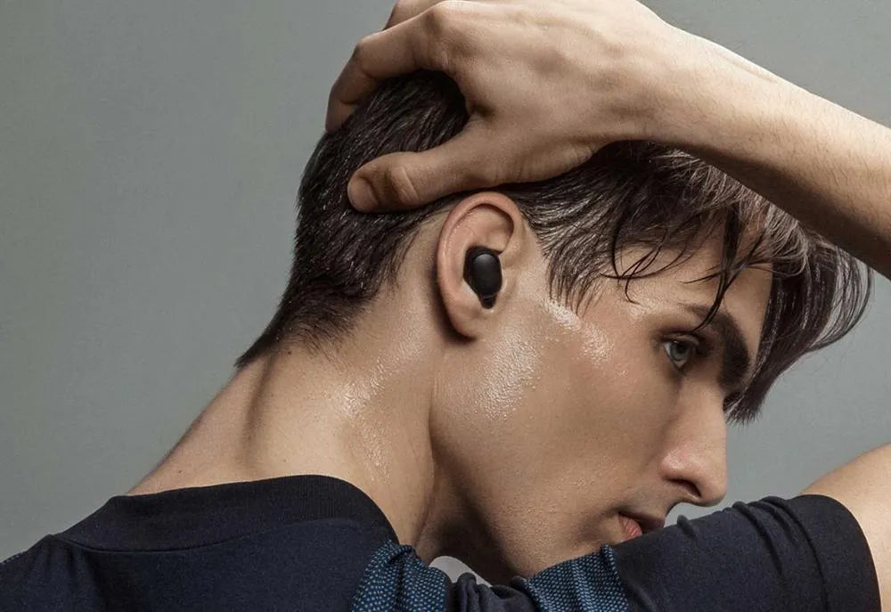 Redmi AirDots 2 Black true wireless Bluetooth earbuds and charging case on a white background.