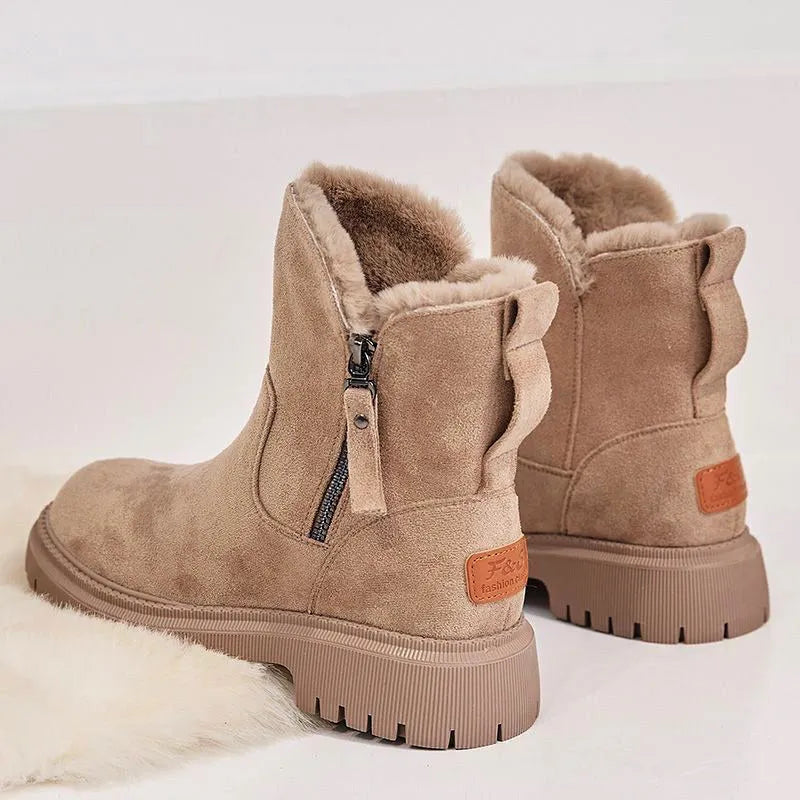Women's black high-top snow boots with side zipper and faux fur lining shown alongside khaki colour option