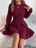 Solid colour acrylic sweater dress with long lantern sleeves and an elastic twist waist.