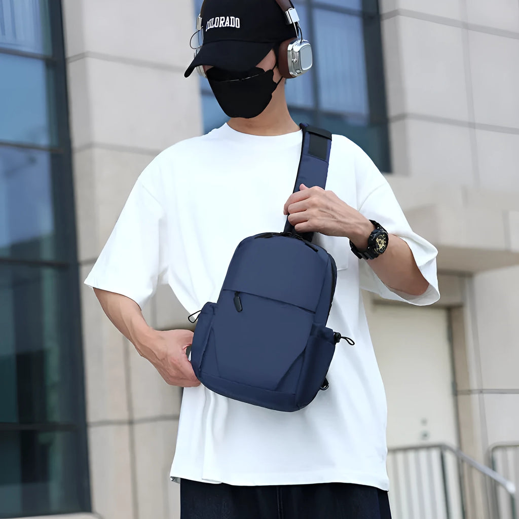 Men's grey waterproof polyester chest bag showing 33cm height dimension