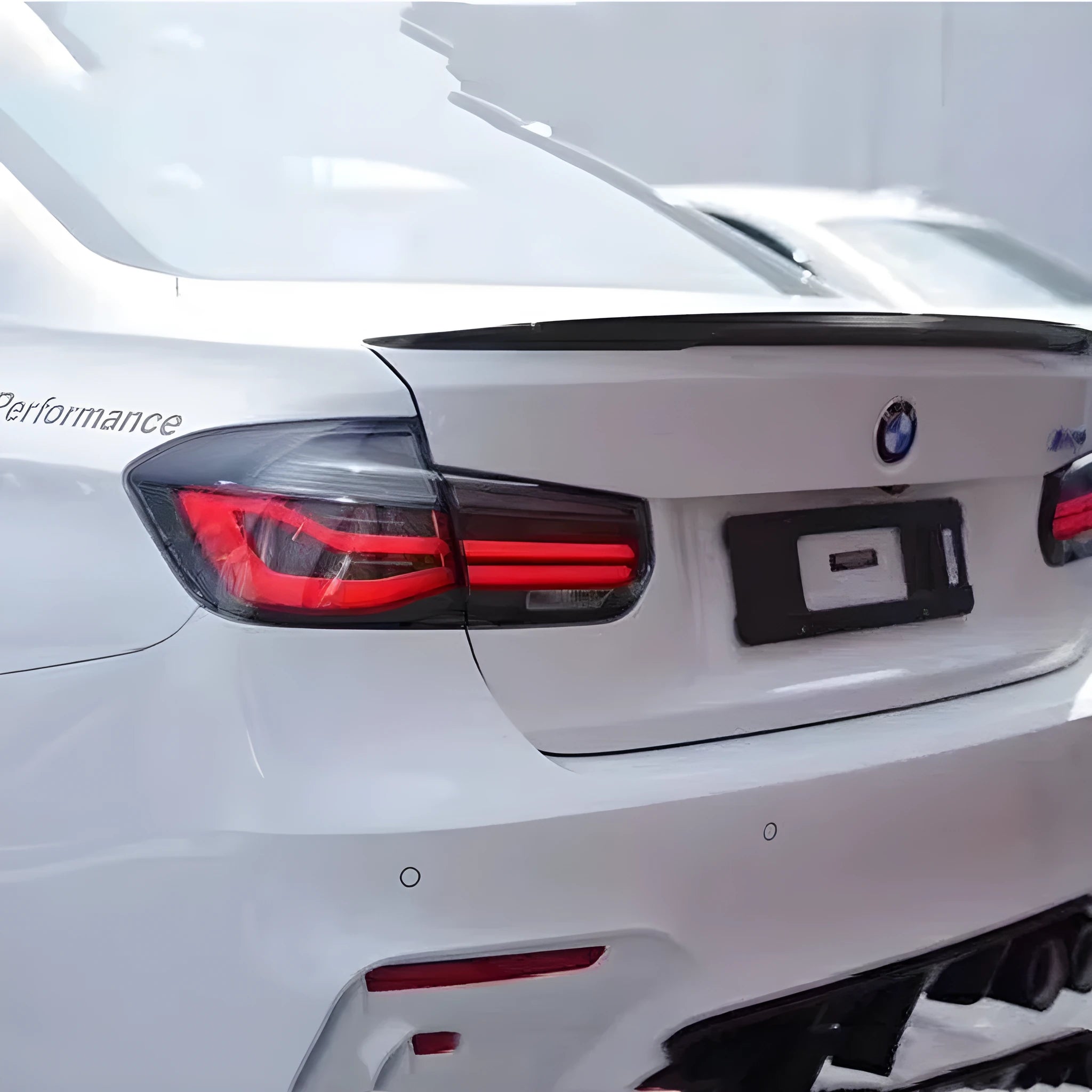 BMW 3 Series tail light assembly with LED running lights in red or smoked black finish