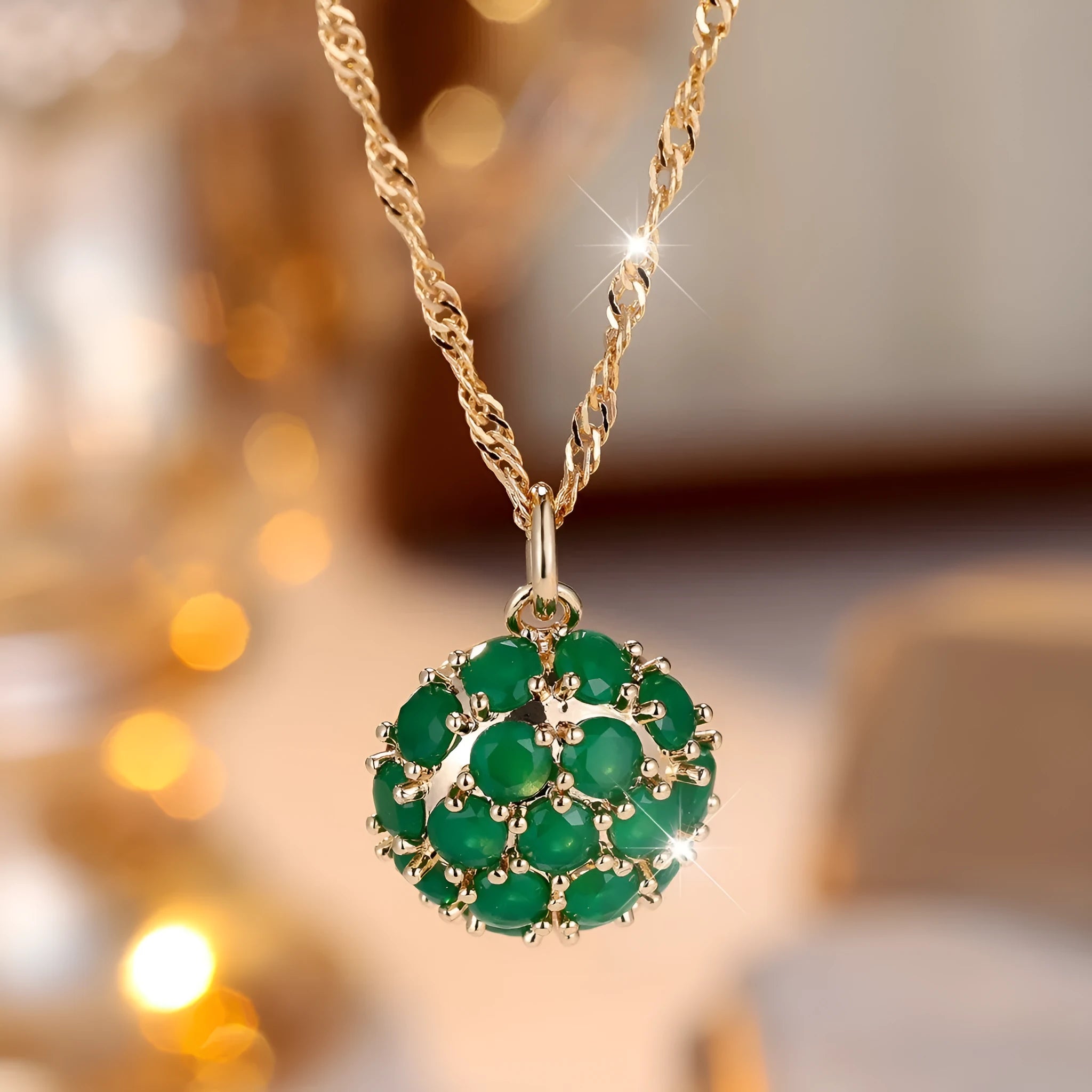 Round emerald and diamond necklace with adjustable chain in champagne gold
