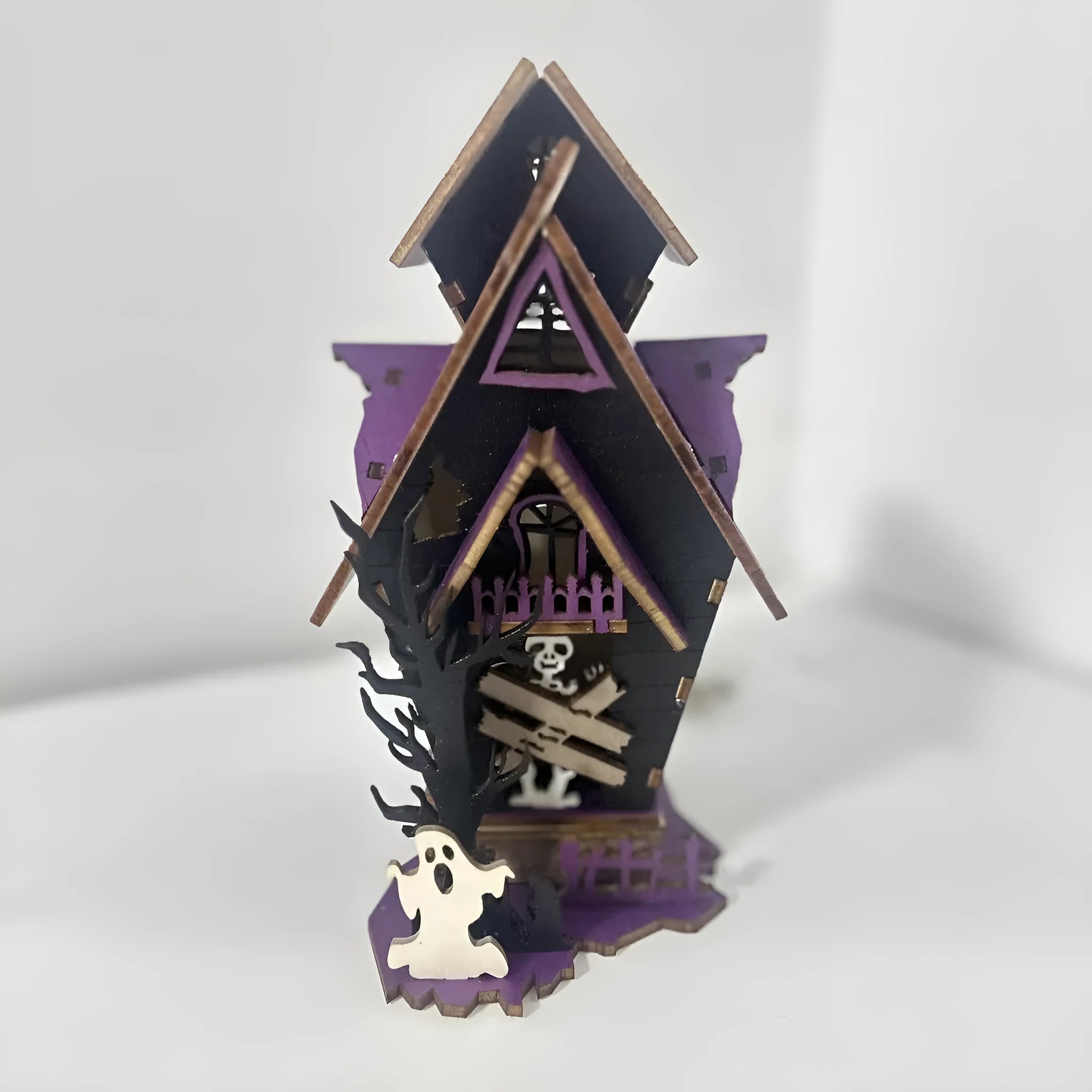 Wooden glowing haunted house Halloween table decoration with candlestick holder function.
