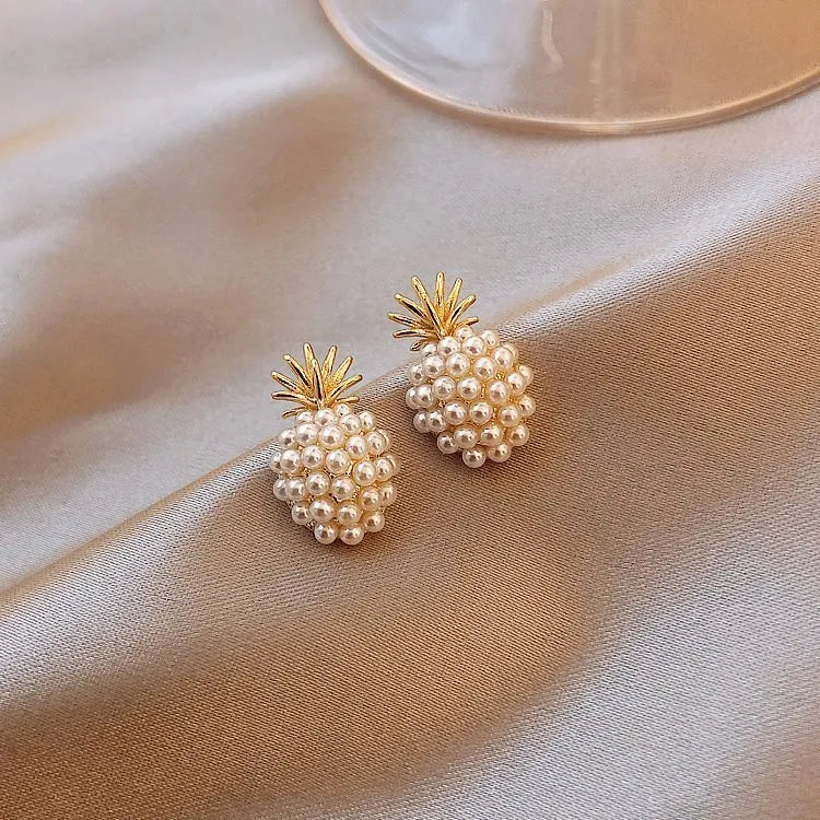 Korean-style pineapple starfish pearl earrings in electroplated alloy with decorative gemstones.