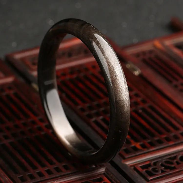 Natural silver stone cat's eye ethnic geometric bracelet made from crystal and alloy.