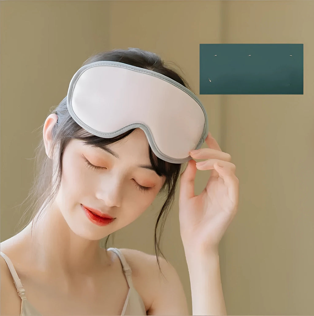 Green portable eye massage mask with suede exterior on a white background.