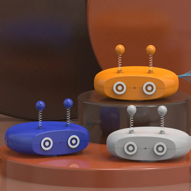Electric robot laser cat toy with feather teasing stick, USB rechargeable, shown in Blue, Grey and Yellow