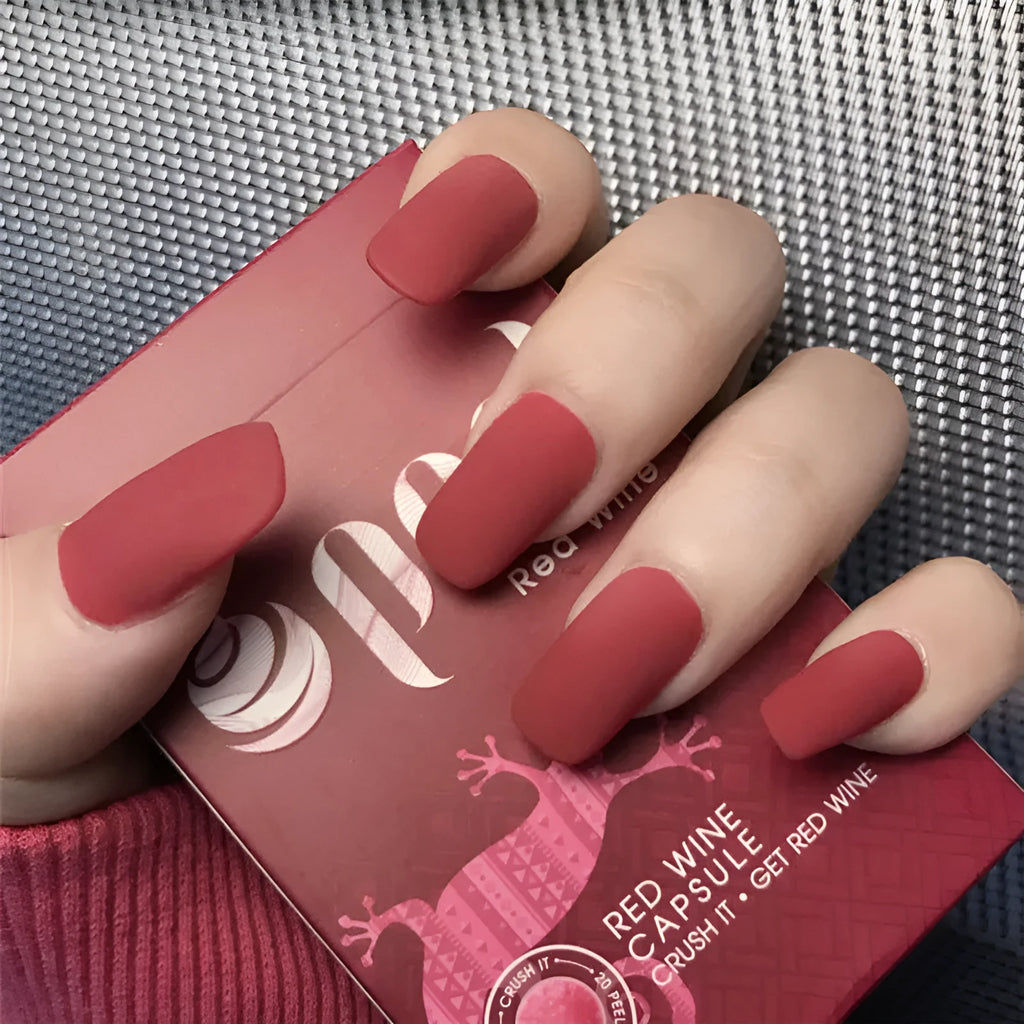 24-piece matte red medium length false nail set with glue-on application, approximately 27g net content
