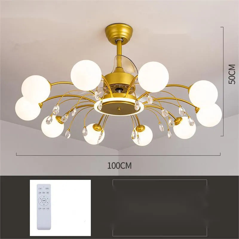Black and gold ceiling fan light fixture with acrylic shade and metal blades, shown with remote control