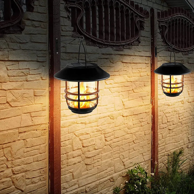 Solar LED outdoor glass wall lamp with IP65 rating, shown as a wall-mounted garden light in Flame light or Warm light