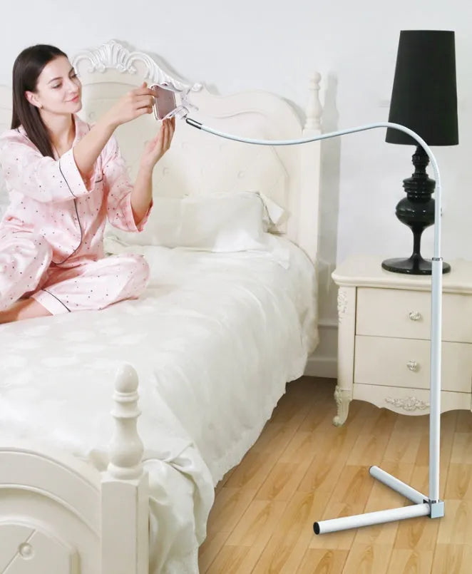 Black mobile phone bed bracket with overhead support shelf mounted for bedside TV watching