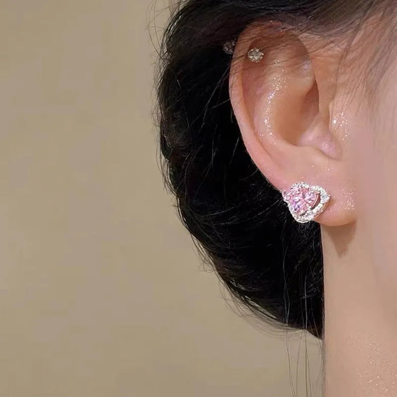 Guardian Heart white K stud earrings with heart shape design and butterfly backs.