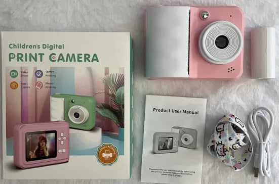Mini portable photo printing camera in blue or pink standard with 2.4 inch ABS plastic body and included printing paper and lanyard