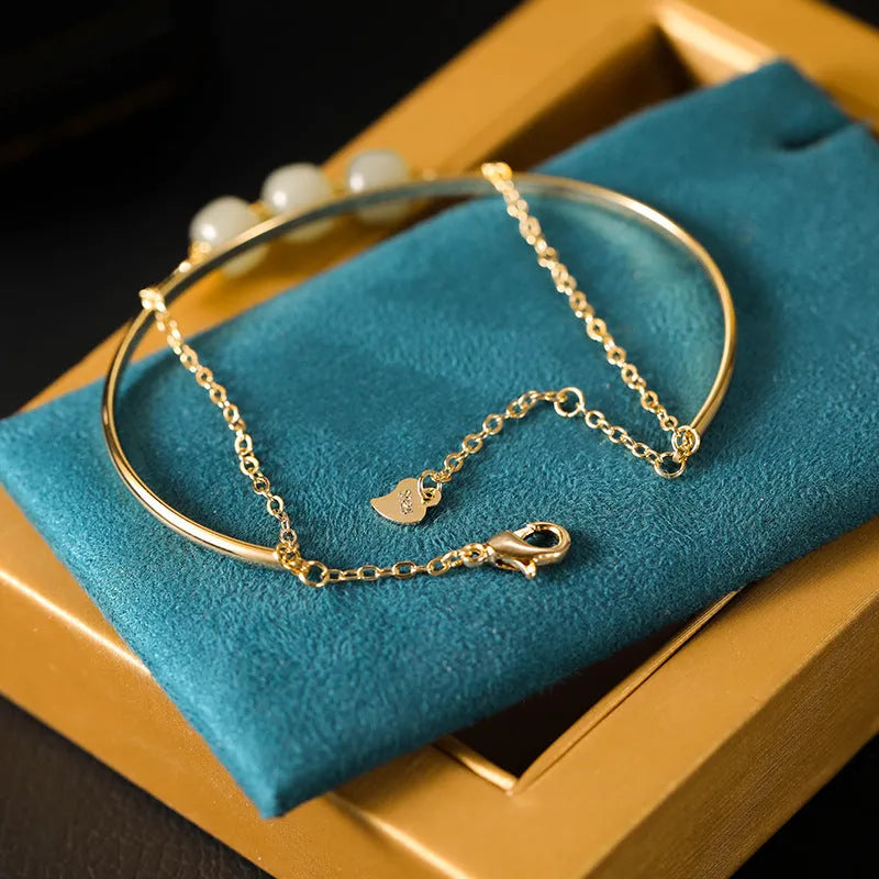 Women's Hetian jade bracelet with gold inlay design available in single, double or three bead versions