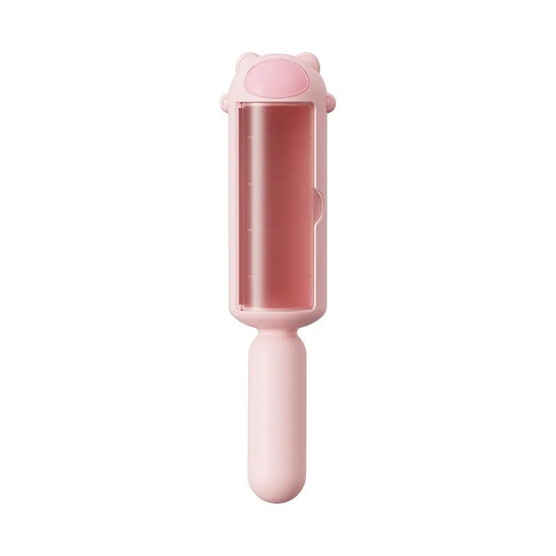 Blue pet hair remover roller with self-cleaning base for furniture and car seats.