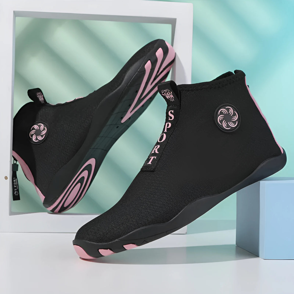 Black and fluorescent green mesh upstream beach shoes with a non-slip rubber sole.
