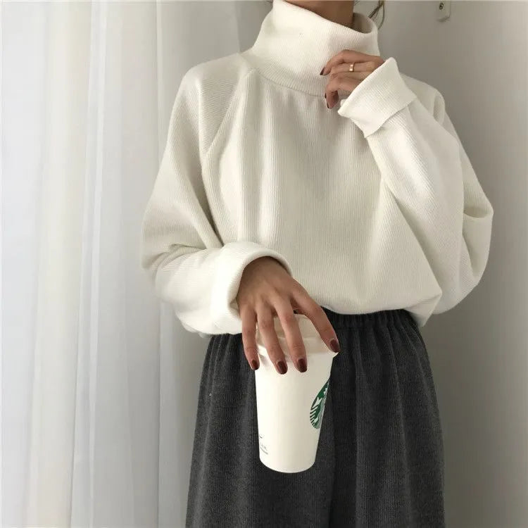 Women's loose fit long sleeve top with half-high collar in solid apricot colour