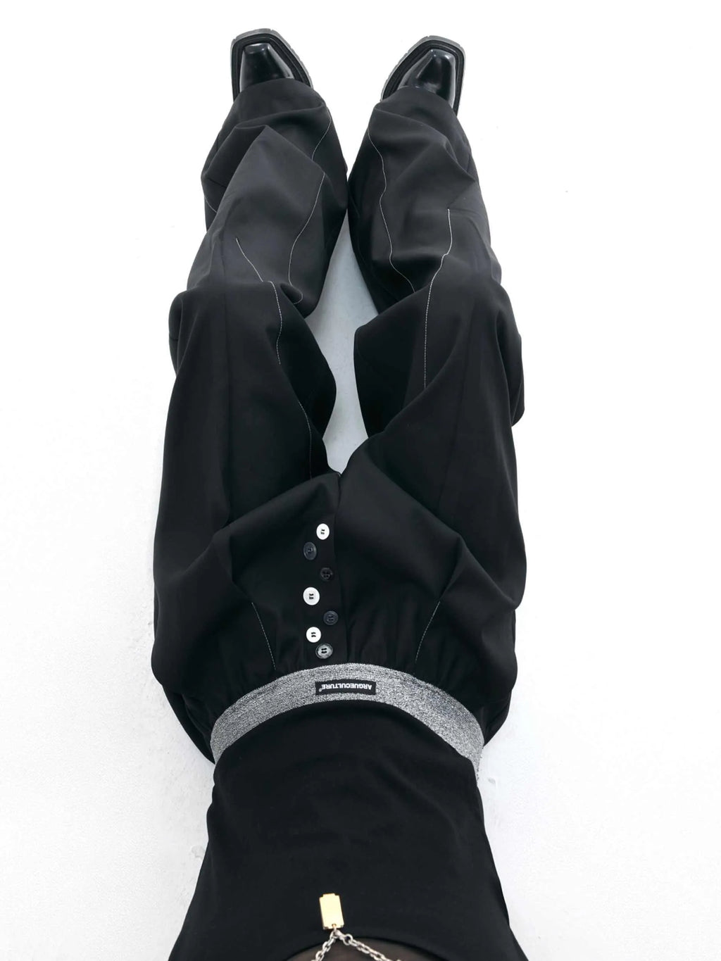 Drooping straight-leg suit pants in black with button open line design and high-waisted fit
