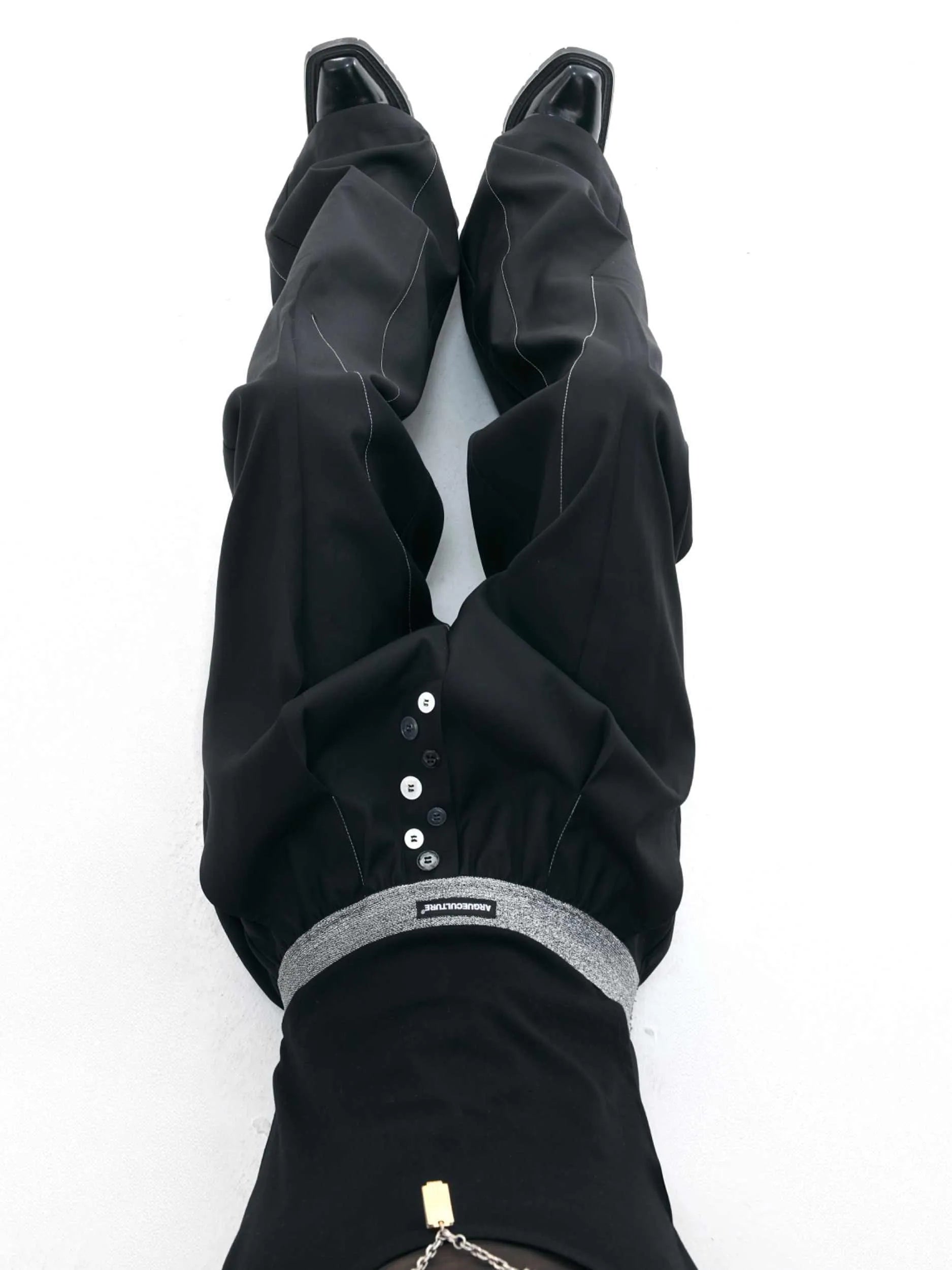Drooping straight-leg suit pants in black with button open line design and high-waisted fit