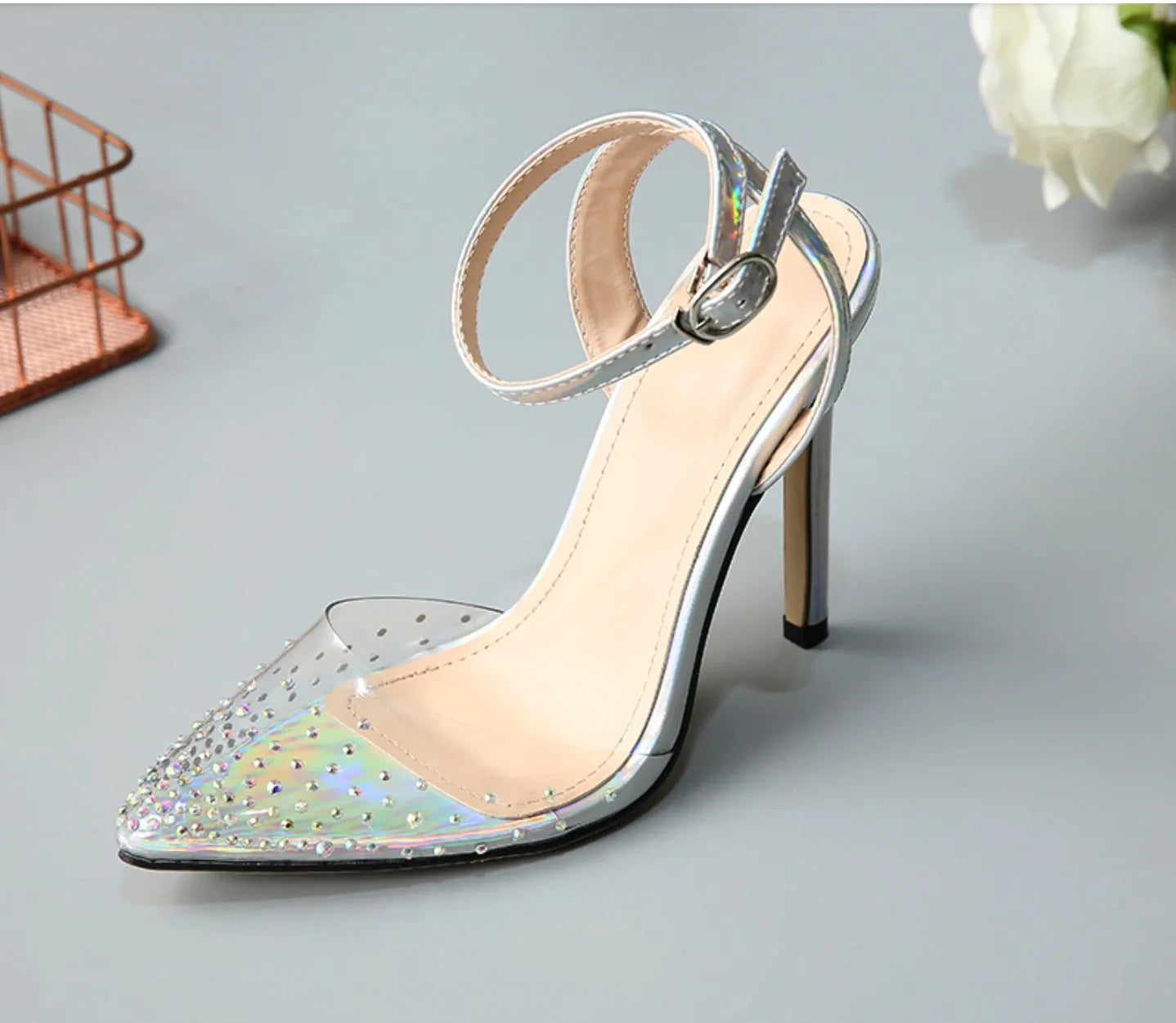 Women's pointed toe stiletto sandals with diamond details on a PVC upper.