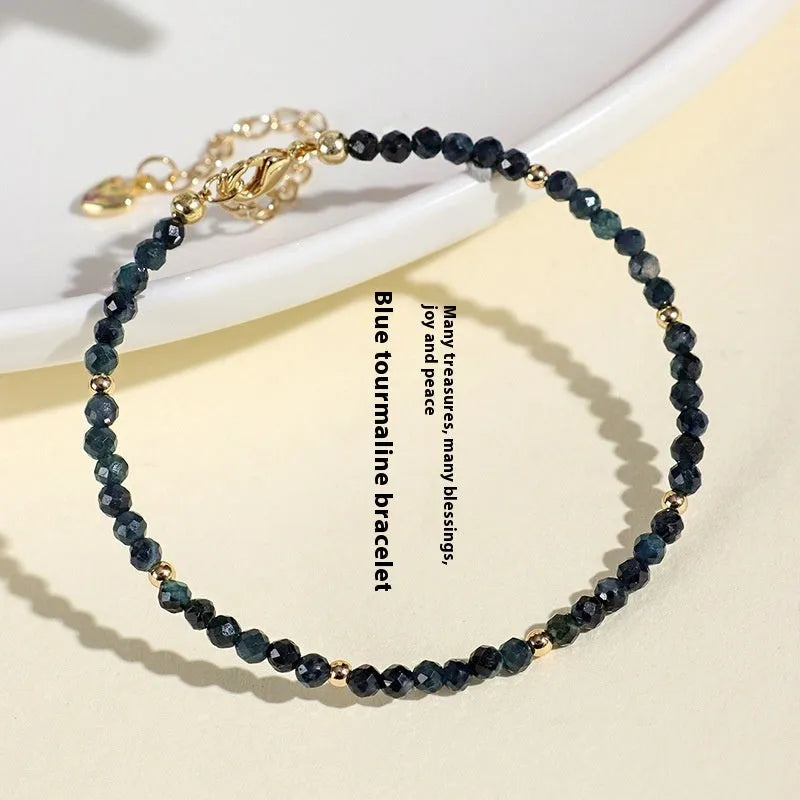 Close-up of a blue tourmaline and spacer bead bracelet for women.
