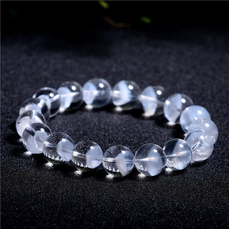 Women's white crystal ghost pyramid bracelet with ruyi element on wrist