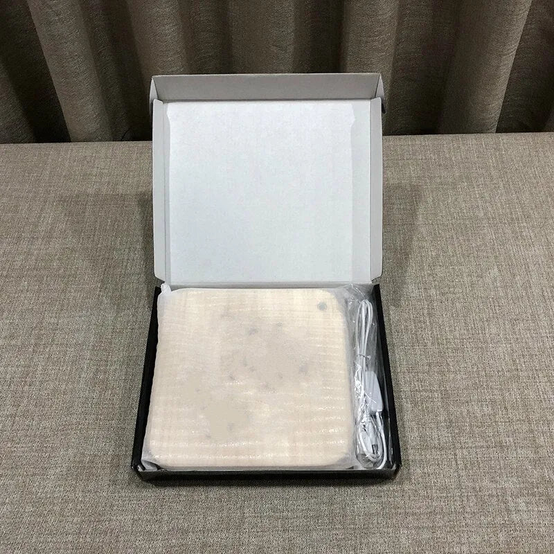 Square pine wood USB LED atmosphere lamp with warm white light on a surface.