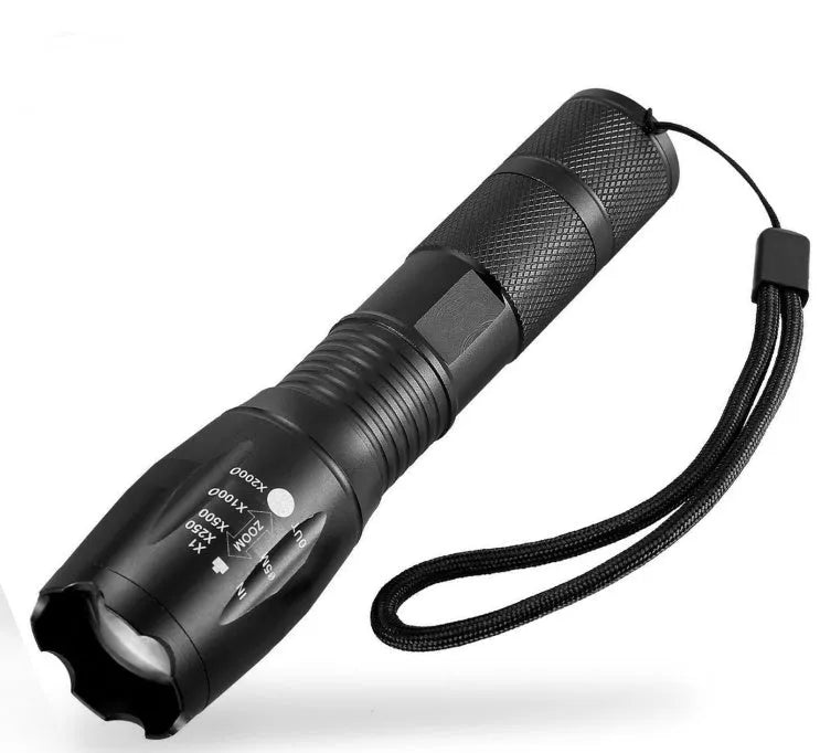 Black aluminium alloy zoomable LED flashlight with adjustable focus ring and textured grip.