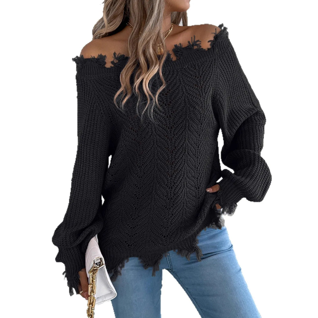 White hollow-out off-the-shoulder long-sleeve pullover sweater laid flat.