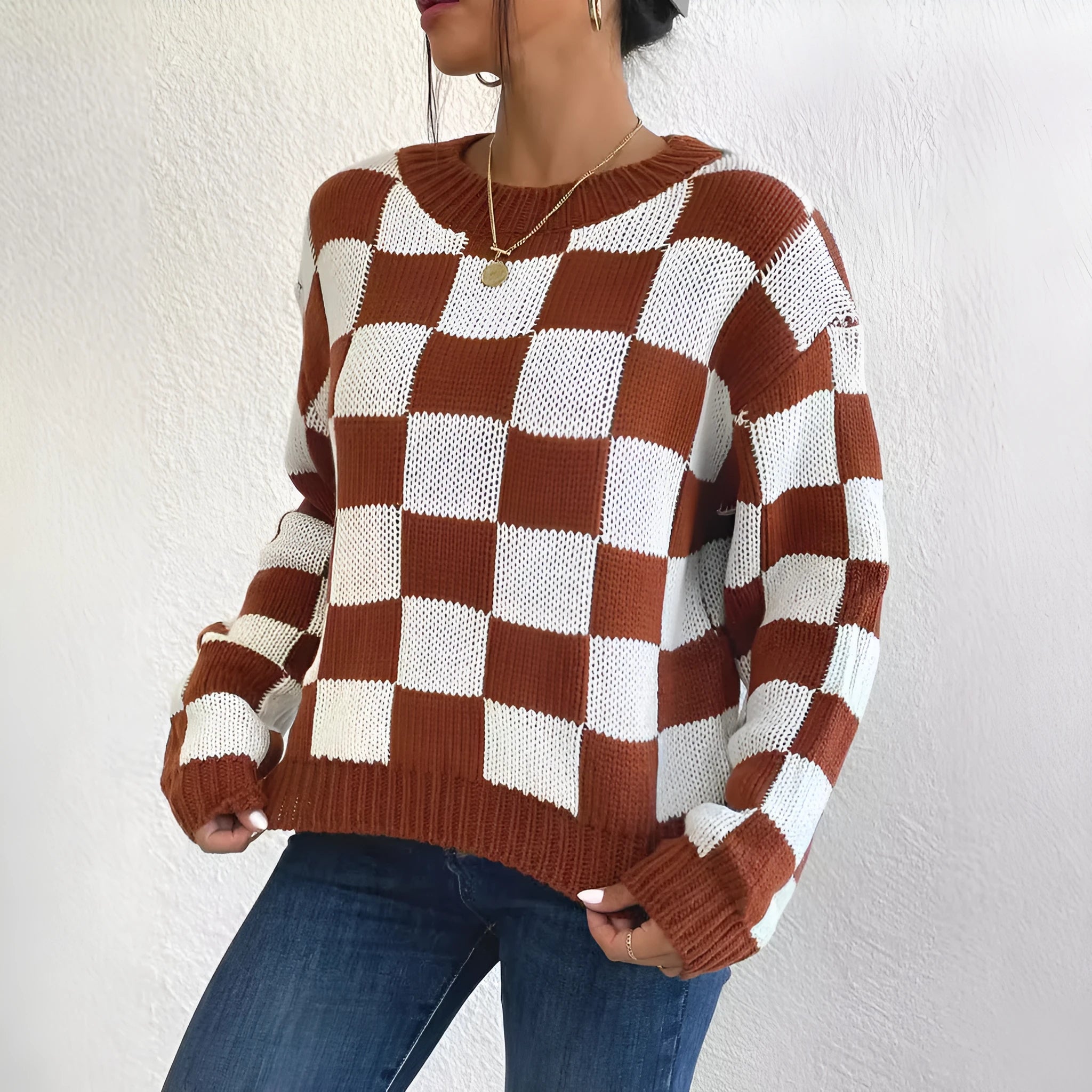 Dark brown acrylic pullover sweater with chessboard plaid pattern, loose round neck and long sleeves