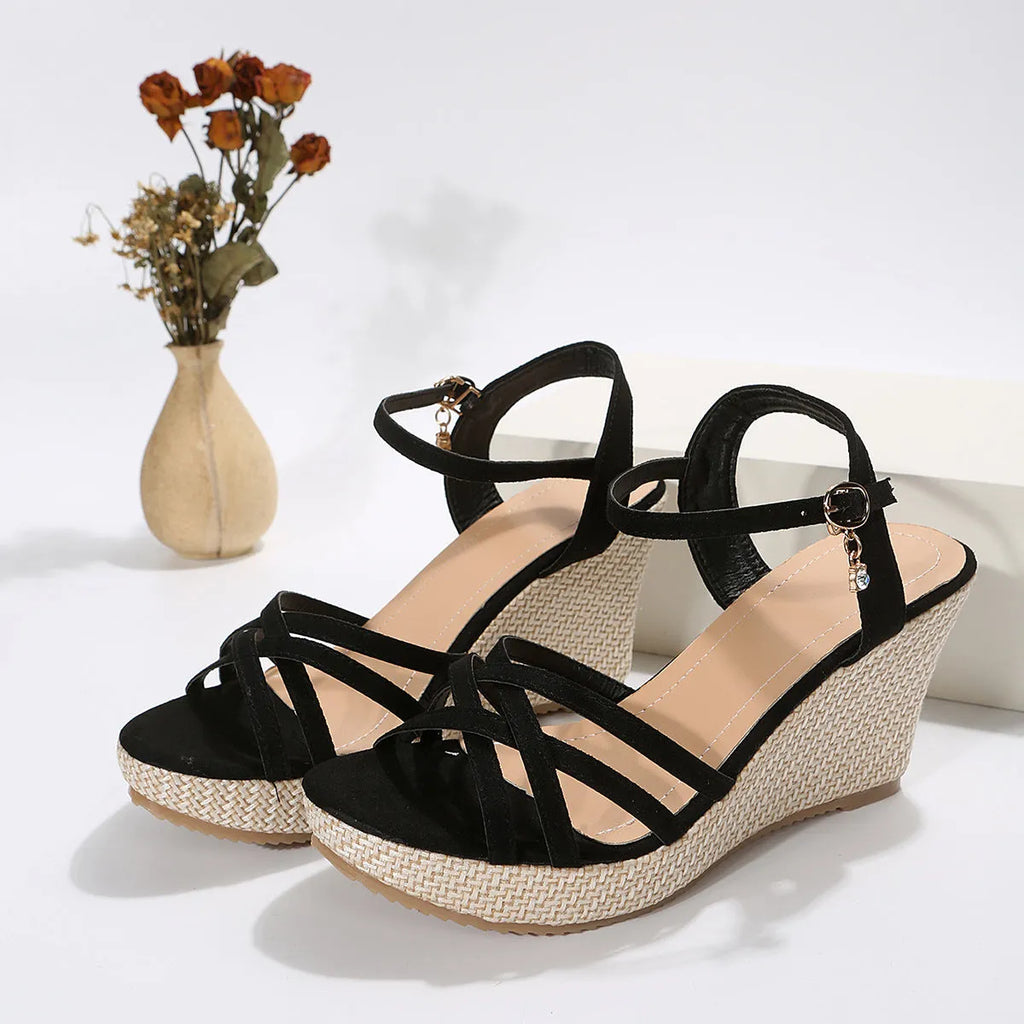 Women's black wedge sandals with fish mouth toe open design and fabric upper.