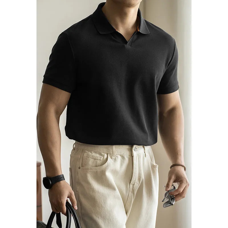 Blue short-sleeved cotton blend polo shirt on a hanger, showing regular fit and button placket.