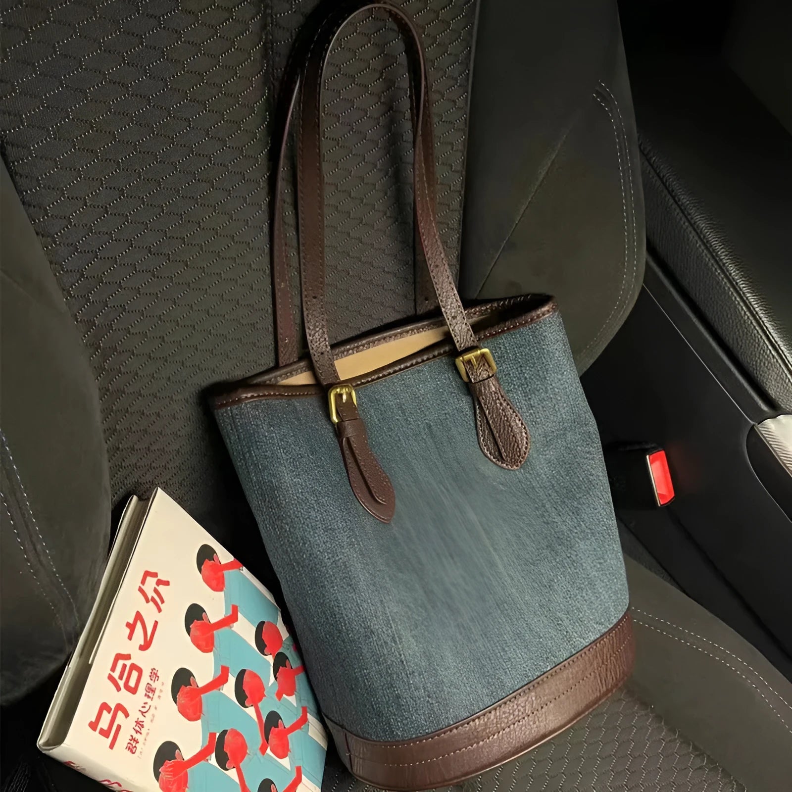 Large denim patchwork retro bucket handbag with a one-shoulder strap.