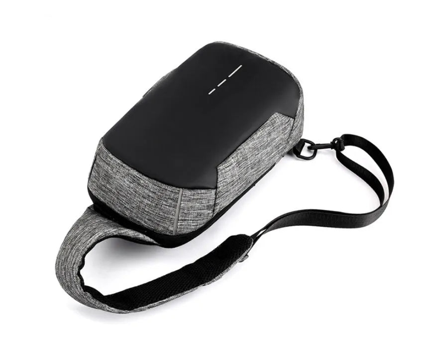 Oxford cloth waterproof chest bag in dark blue colour showing front zipper compartment and adjustable strap