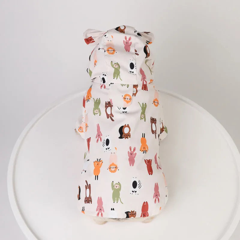 Beige dog raincoat with a cartoon animal print, showing sizing options for waterproof pet wear.