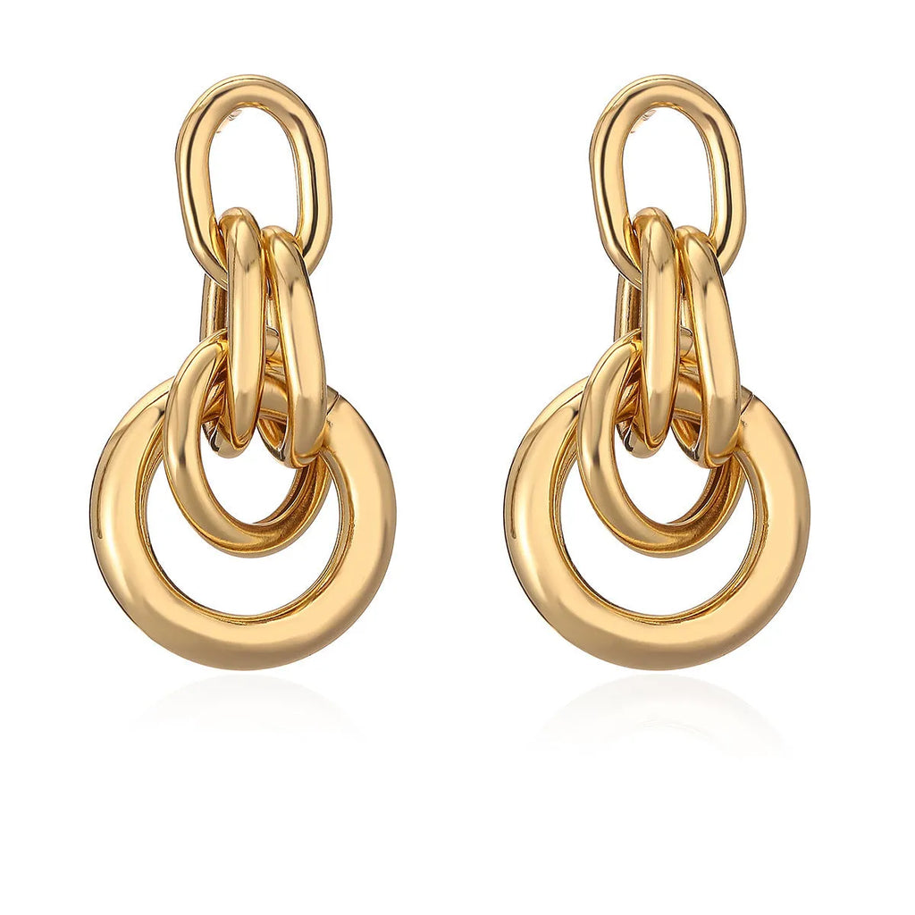 Geometric gold earrings with irregular design elements on copper base with gold electroplating