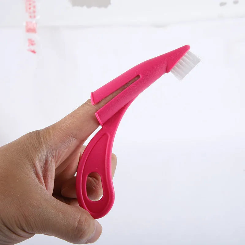 Red and white finger toothbrushes for pet dental cleaning with silicone bristles