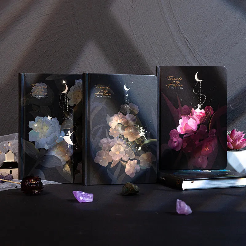 A5 diary notebook with luminous holographic cover open to show pages with colour illustrations.