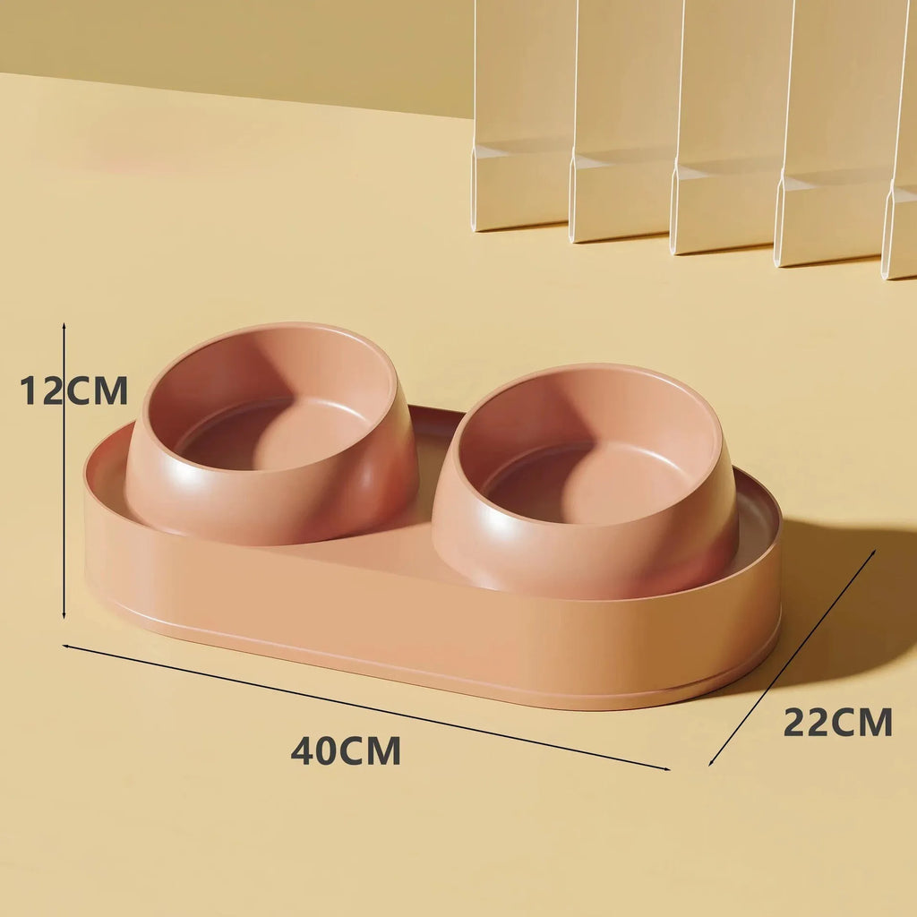 White elevated pet feeder with two tilted bowls on a separate rack, for cats and small dogs.