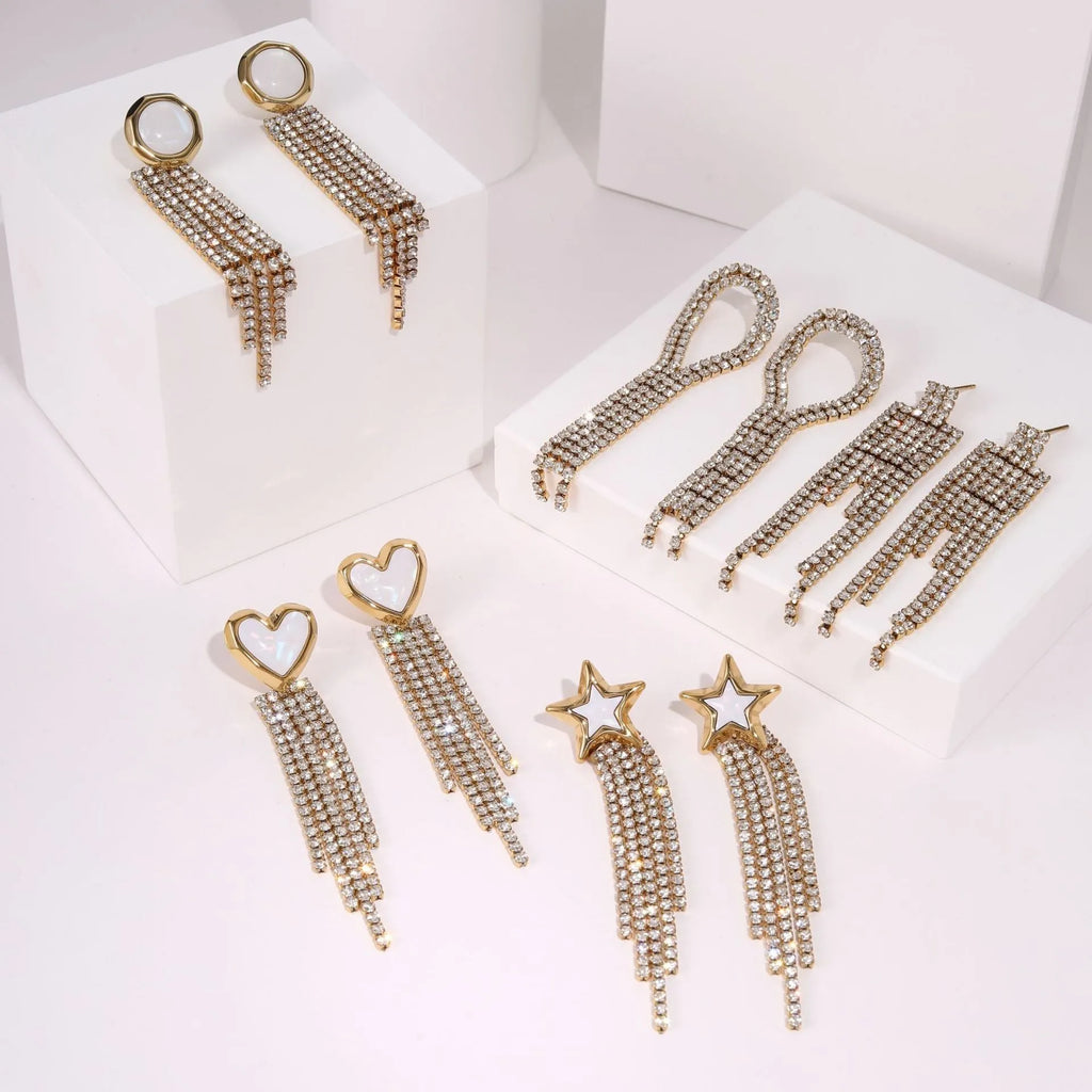 Women's stainless steel earrings with 18K electroplating in heart, star and geometric shapes featuring diamond tassels