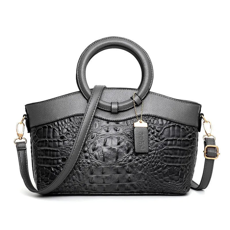 Ladies fashion handbag in multiple colours with zipper compartments measuring 31cm by 21cm by 13cm