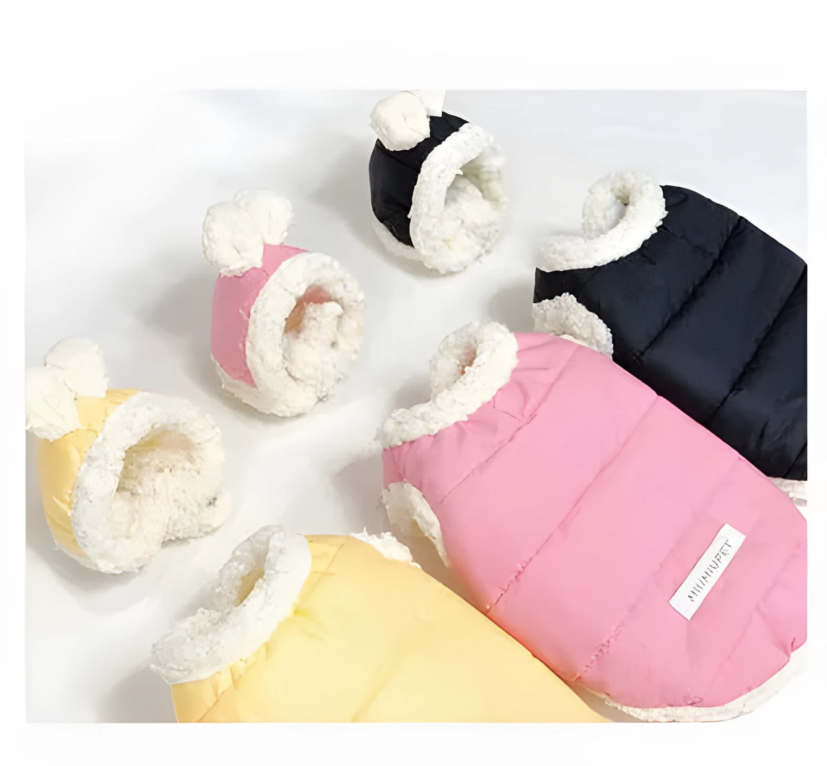 Cotton-padded pet coat in yellow, black and pink, sizes XS to XL for dogs and cats.