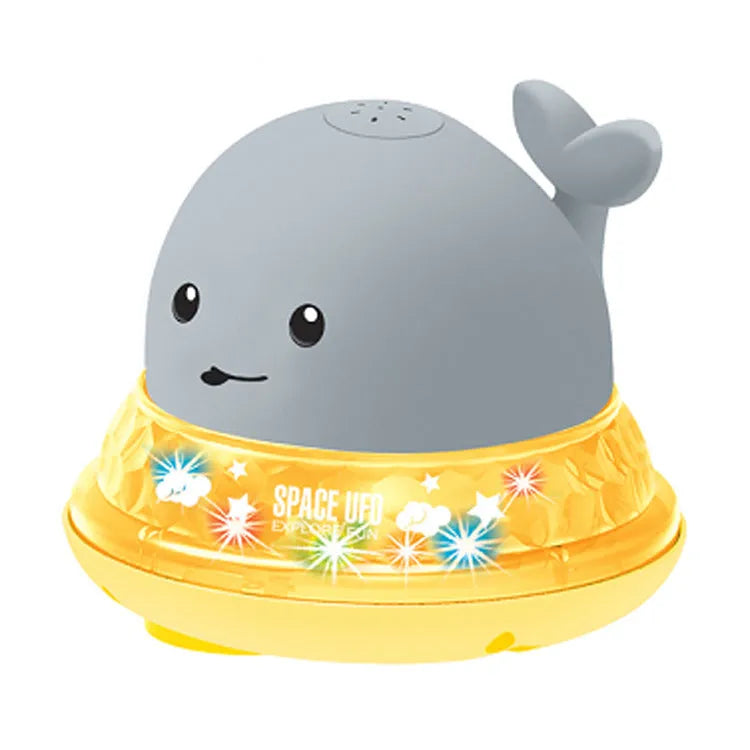 Automatic spray whale bath toy with LED lights floating in water