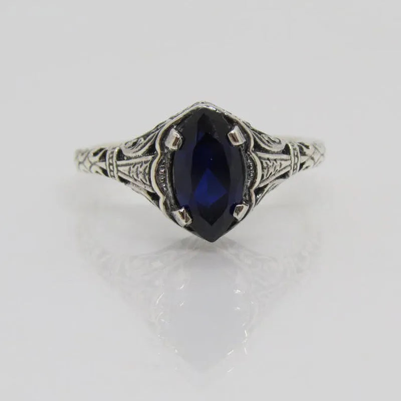 Silver women's ring with geometric hollow pattern in alloy metal showing side profile view