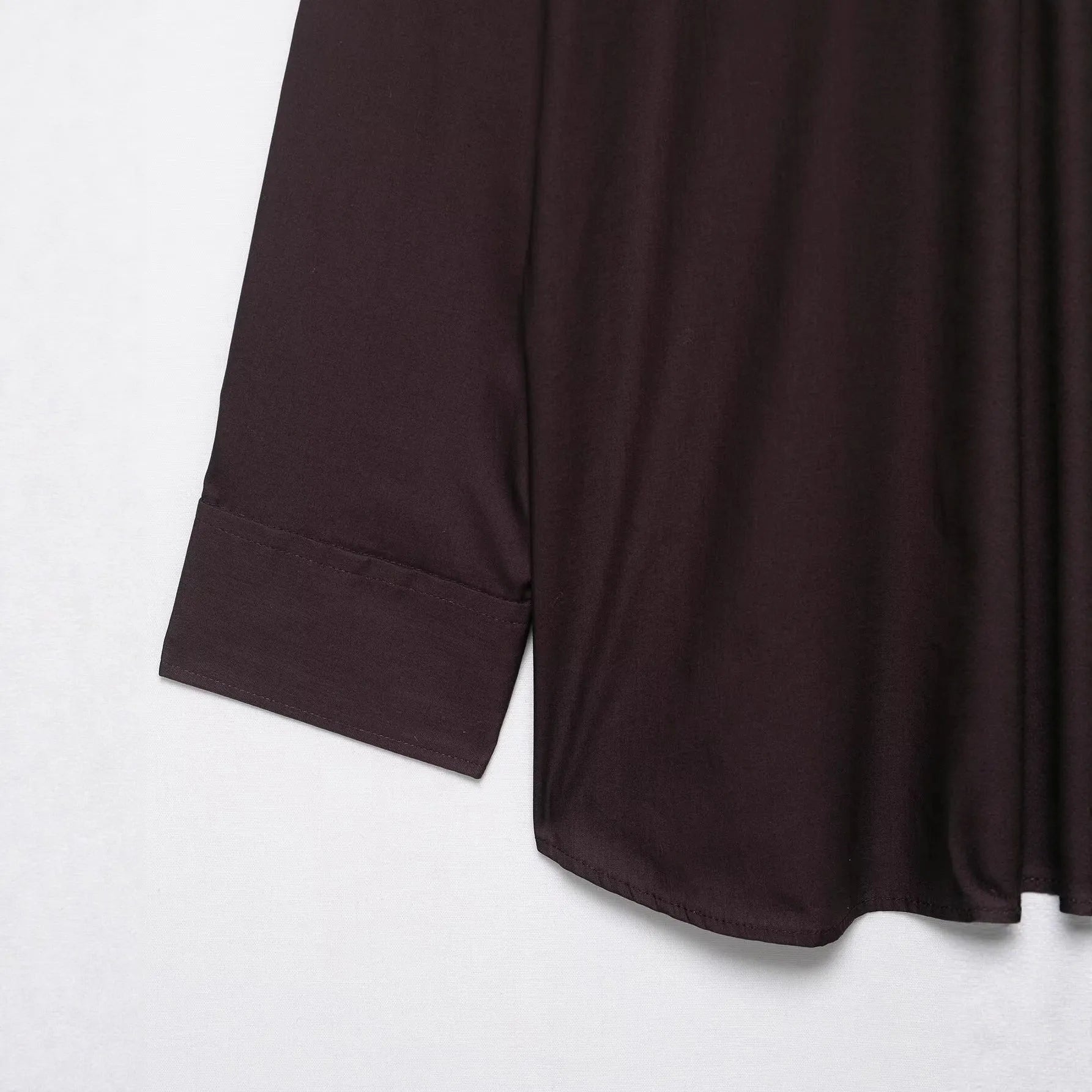Brown women's long sleeve poplin shirt with a bow tie, shown in a loose cardigan style.