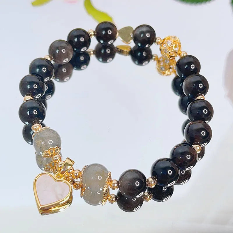 Women's silverstone bracelet with electroplated finish showing floral, love, and star charm designs