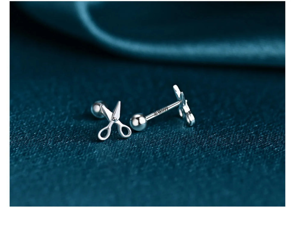 Pure silver screw-back ear nails featuring a miniature scissors charm