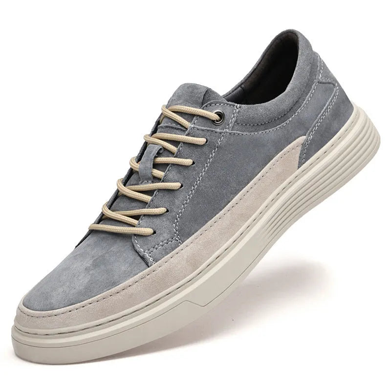 Men's grey casual skate shoes with pigskin upper and rubber sole on white background