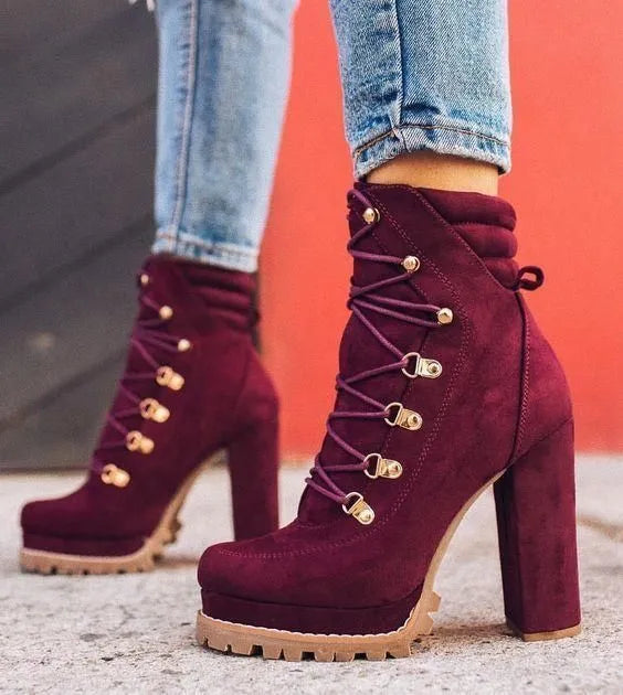 Women's suede high heel ankle boots in army green with thick heel, round toe, rivet details, and a belt buckle.