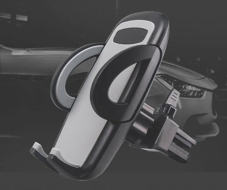 Black plastic car mobile phone holder mounted on air conditioning vent holding smartphone